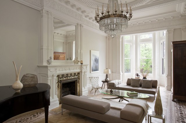 transitional living room with crown molding