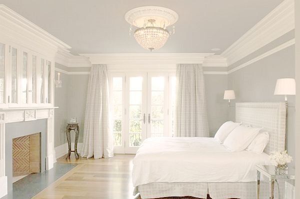 all white bedroom with crown molding