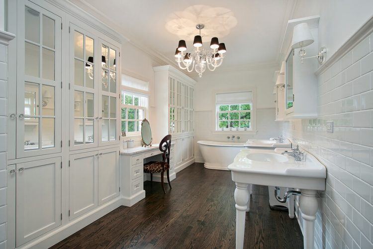 all white bathroom with wood tile flooring