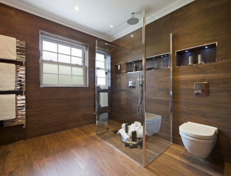 bathroom with wood floor and wall tiles