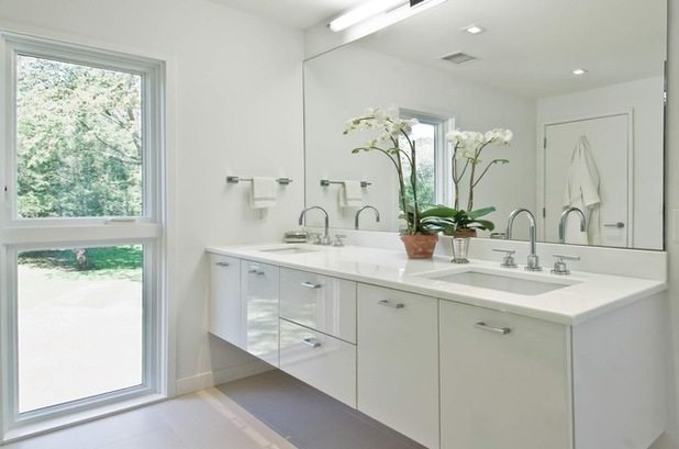 all white bathroom with floating vanity