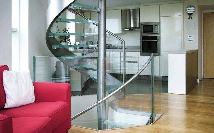 unique spiral staircase with glass railings and steps