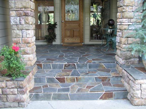 front porch with stone pillars