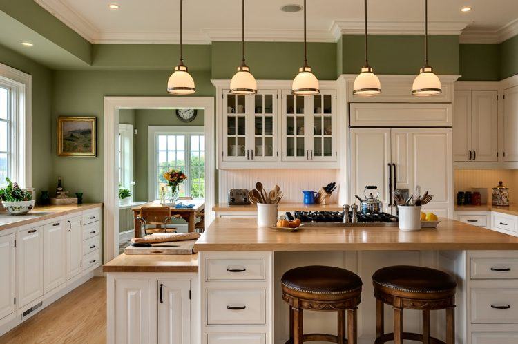 kitchen with light green blue walls gray floor