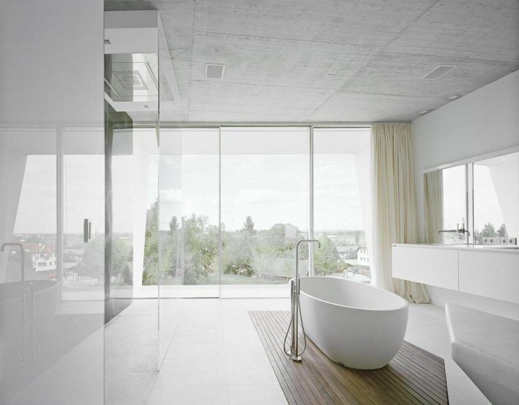 all white bathroom with wooden platform