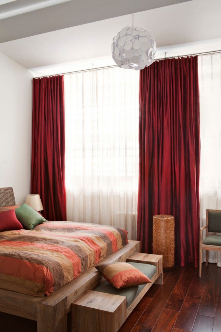 bedroom with beautiful red curtains