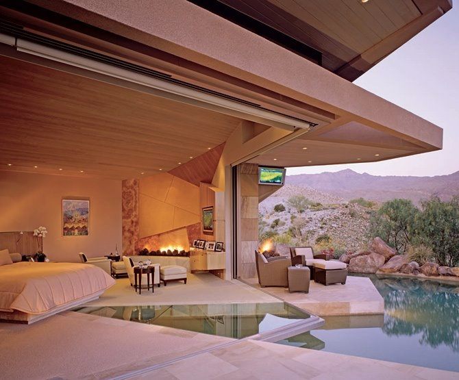 contemporary bedroom with pool overlooking mountains