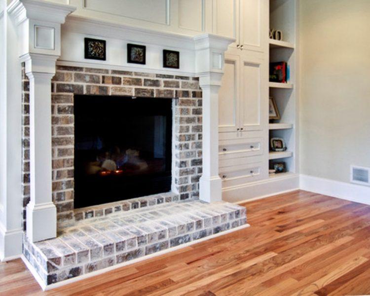 painted brick and wood fireplace