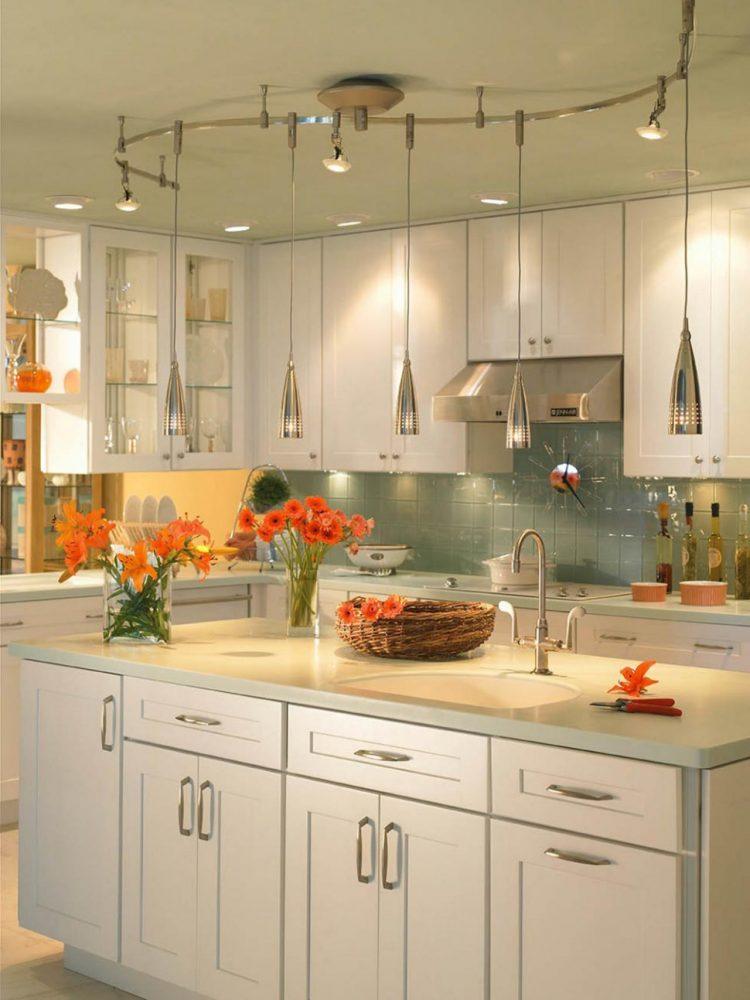 trendy chrome hanging lamps in kitchen