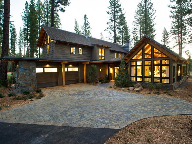 rustic home with brick driveway