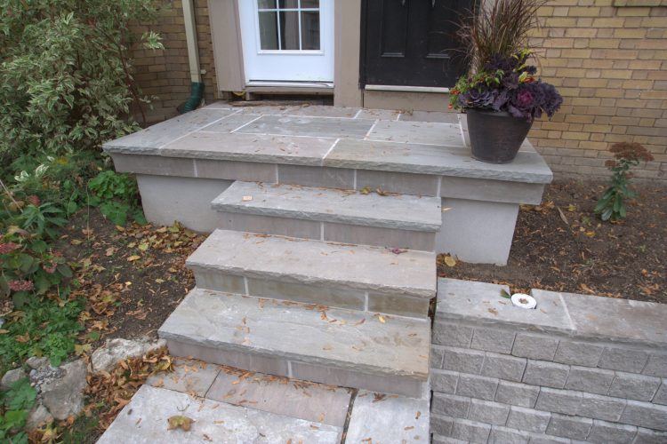 simple stone front porch with steps