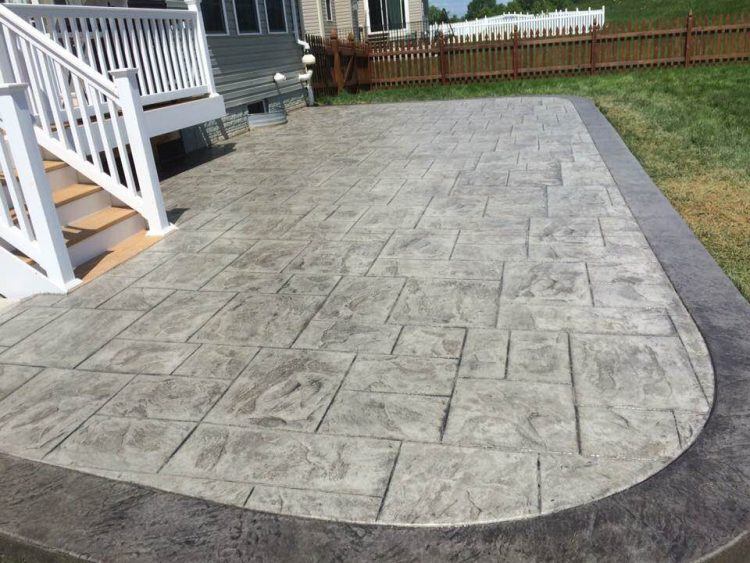 gray concrete patio in backyard