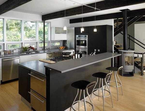 sleek black kitchen island with stools