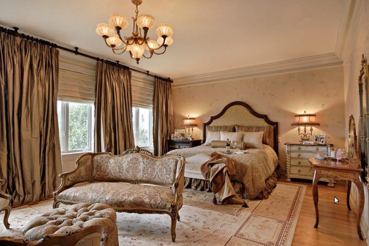 master bedroom with beautiful gold curtains