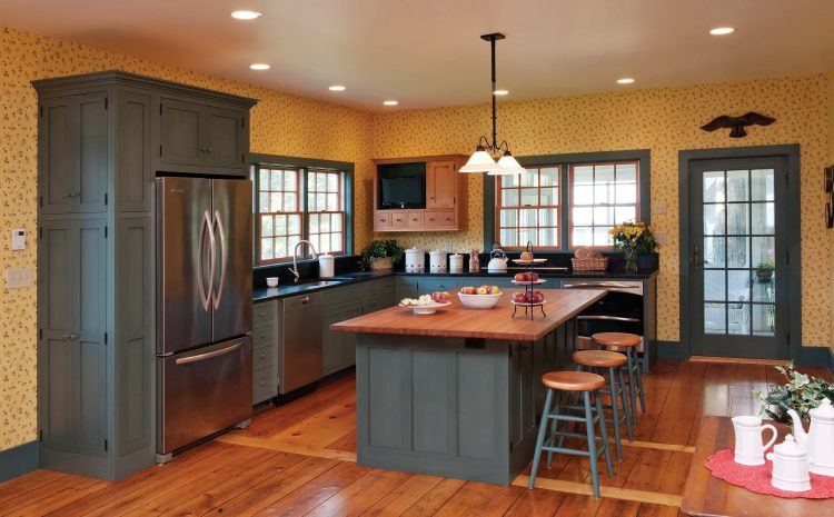 repainted kitchen with wood flooring and island