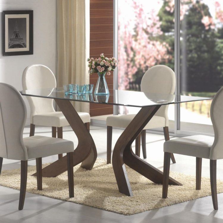 oval table with glass top and white chairs