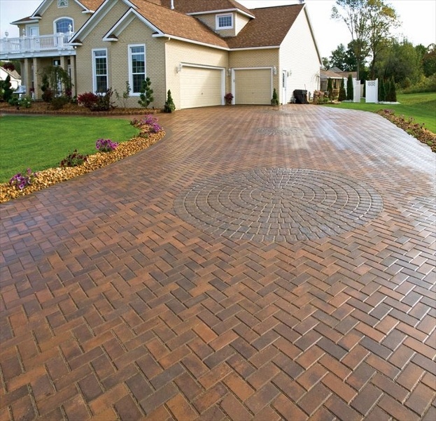 paved driveway with suburban house