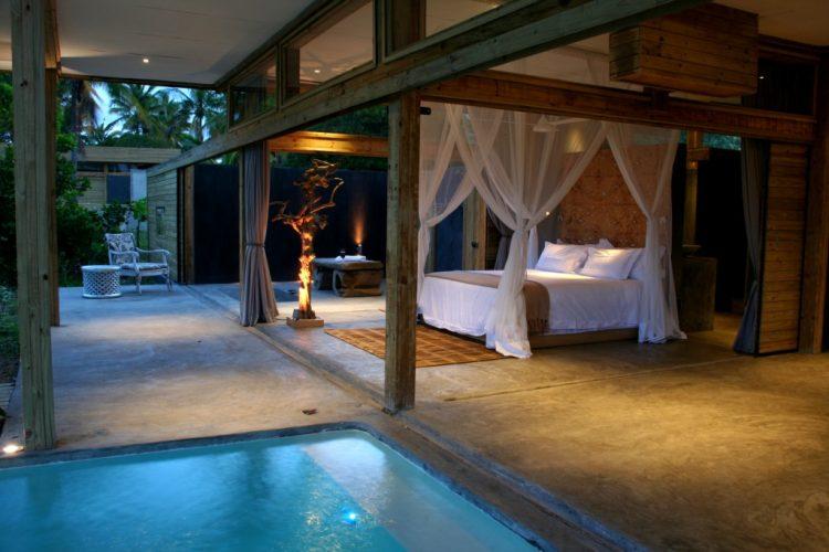 beautiful indoor/outdoor bedroom with pool