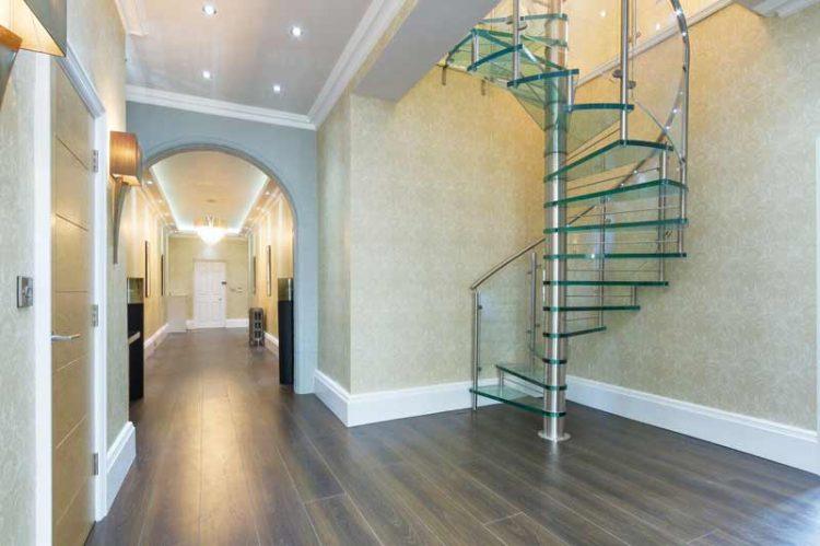 beautiful modern glass staircase with silver pole