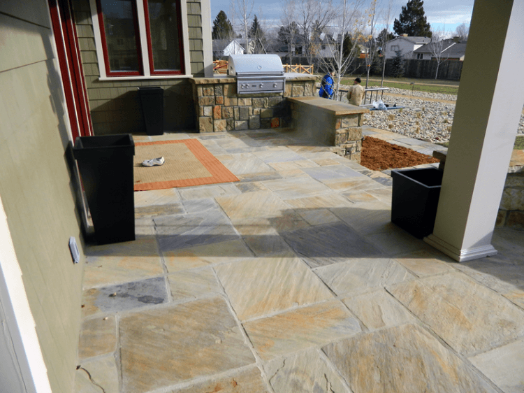 large lavish stone porch in the suburbs