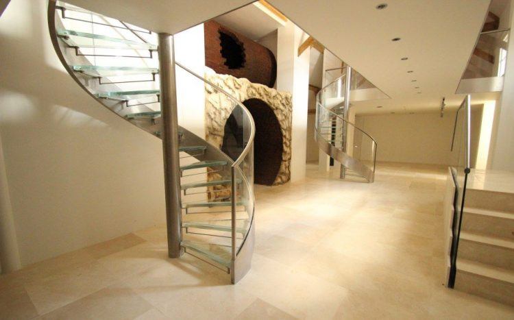 beautiful spiral staircase with glass steps 