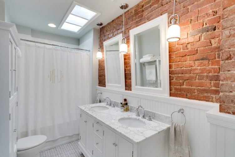 bathroom with traditional brick wall