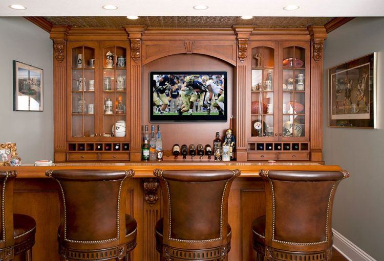 wooden bar in home with flat screen TV