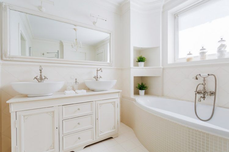 all white bathroom with large window