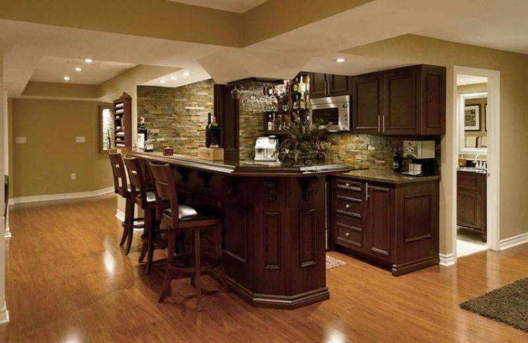 basement bar set up with wooden stools and flooring