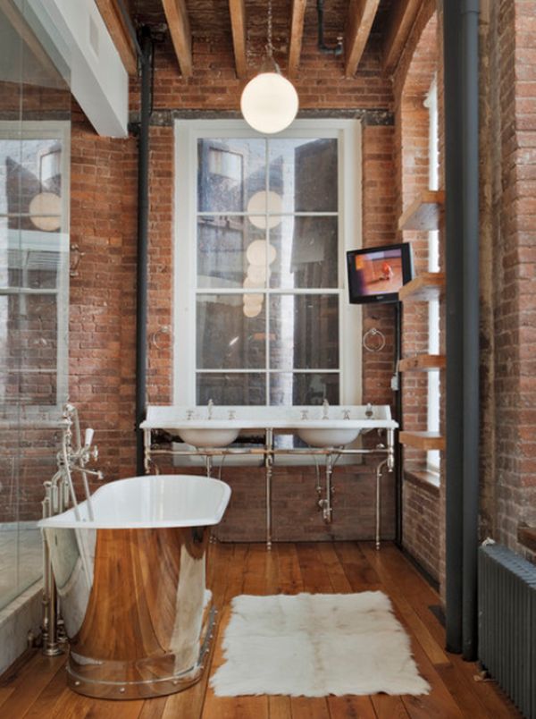 small bathroom with brick wall and freestanding tub