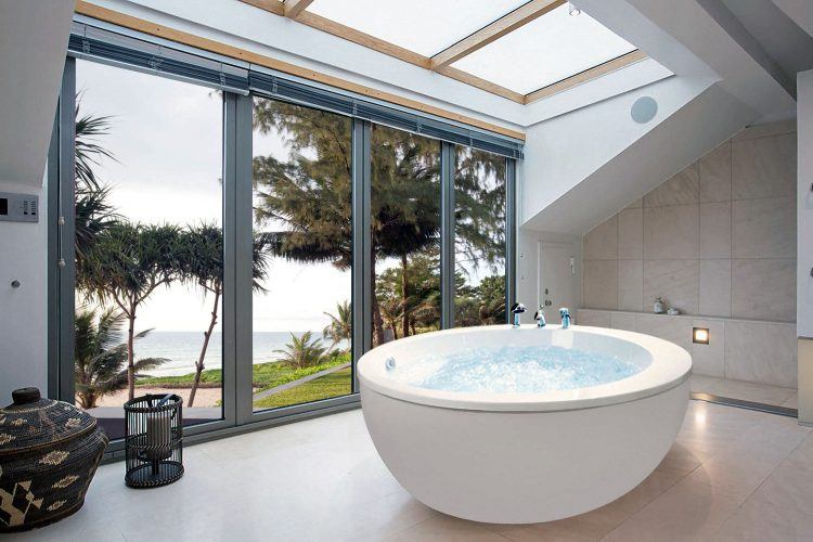 large bathroom with modern round soaking tub