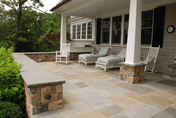 blue stone porch with chairs