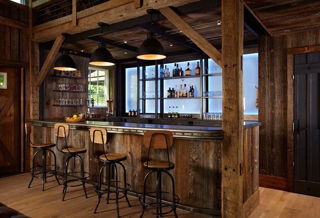 rustic home bar with wood stools