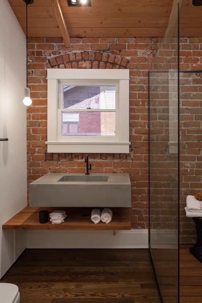 brick wall behind floating vanity