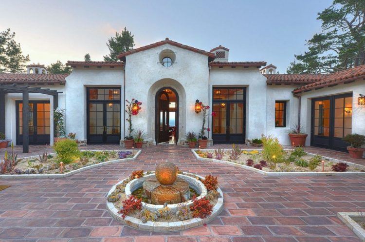 brick driveway with beautiful landscaping