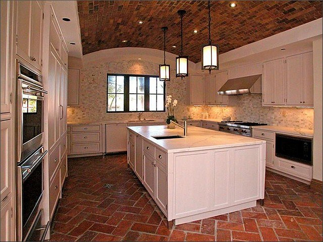 kitchen with brick floor and brick ceiling