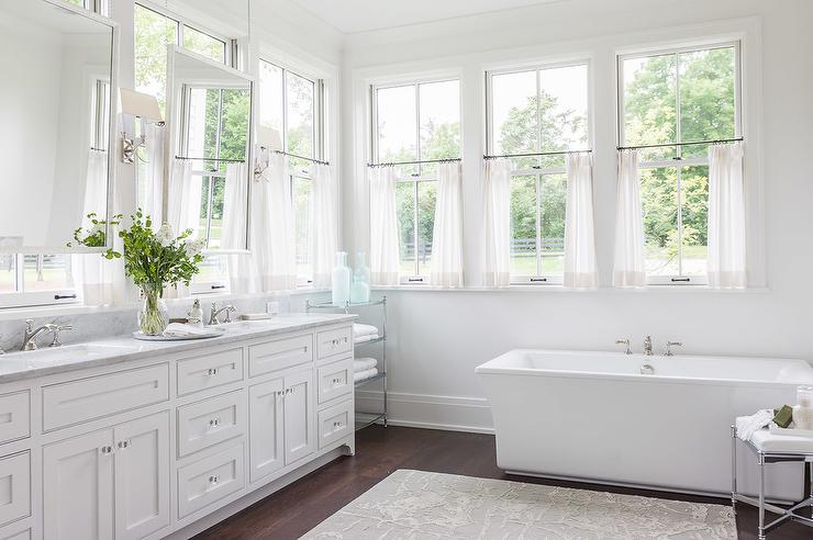 all white bathroom with square tub