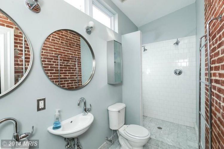 contemporary bathroom with brick wall