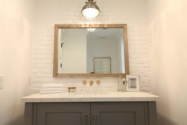 painted brick wall behind vanity