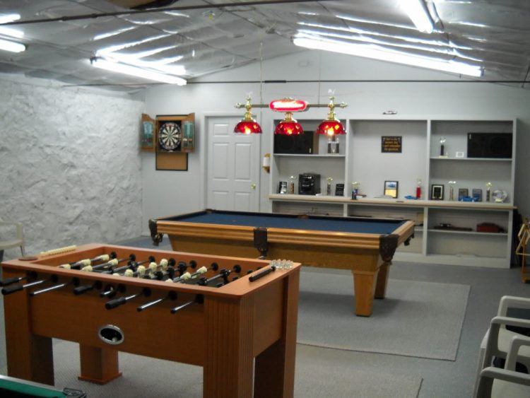 game room with pool table in garage