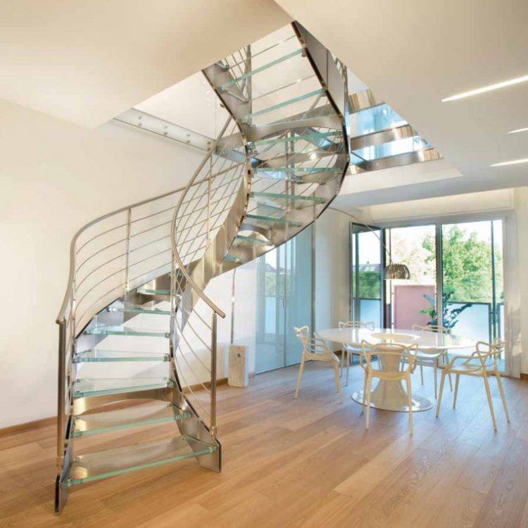 glass staircase with hardwood flooring around