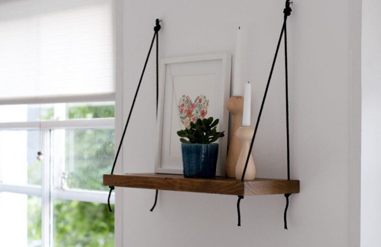 simple wooden shelf hung with ropes