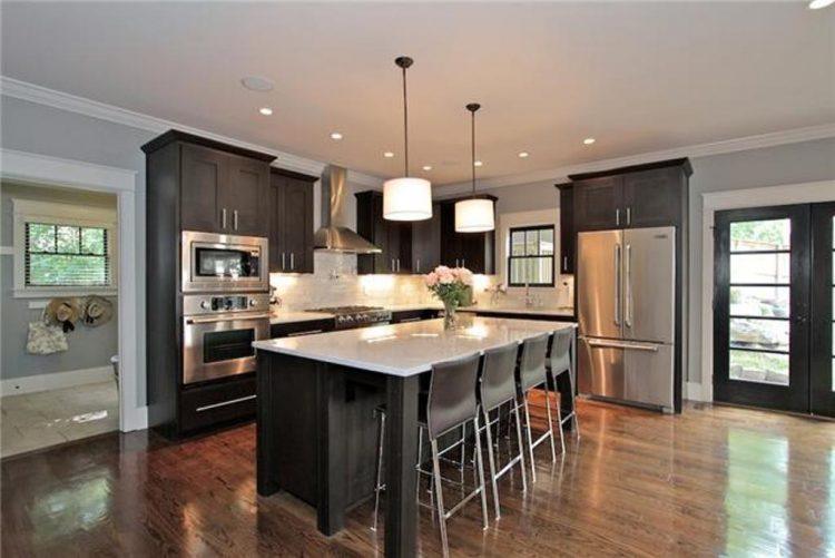 beautiful modern kitchen with hardwood flooring