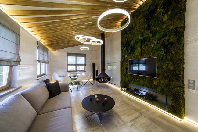 living room with flat screen tv attached to green wall