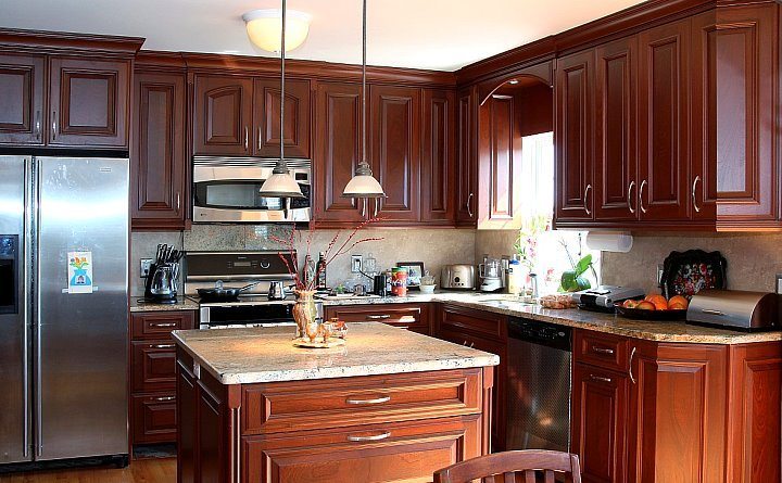 custom made remodeled kitchen with hanging lamp