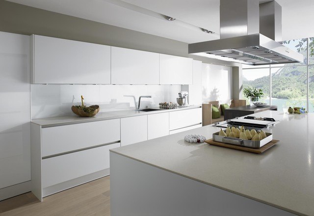 all white kitchen with hardwood flooring