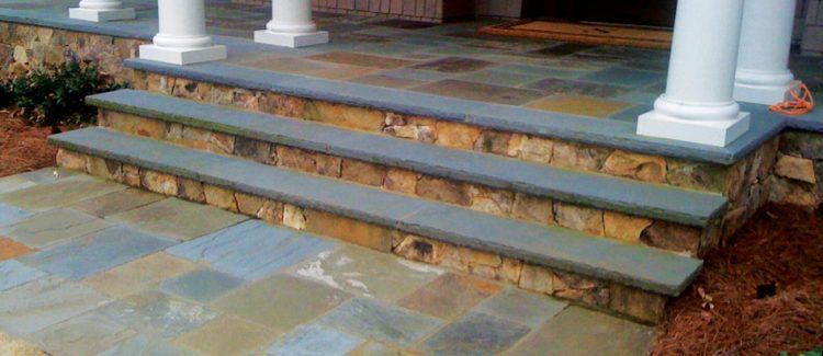 patio style stone porch with three steps