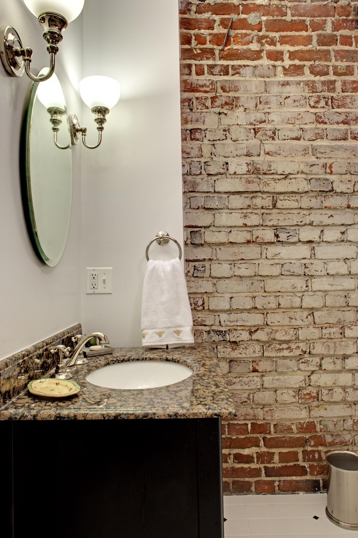 stylish bathroom with brick wall