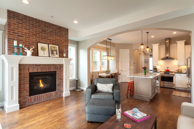 transitional living room with wood flooring