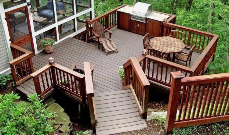 beautiful backyard deck with furniture